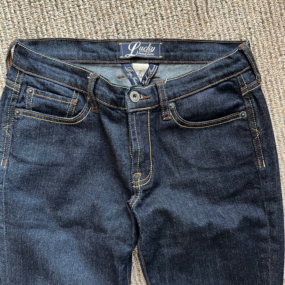 NWOT lucky brand jeans. Dark denim slight bell bottom / boot cut.